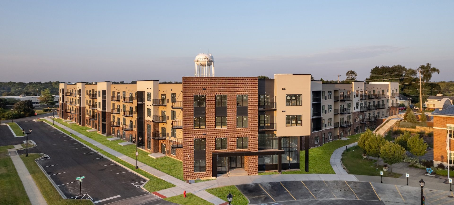 Station 250 apartment complex exterior showing modern multi-story buildings with landscaping in Mundelein IL