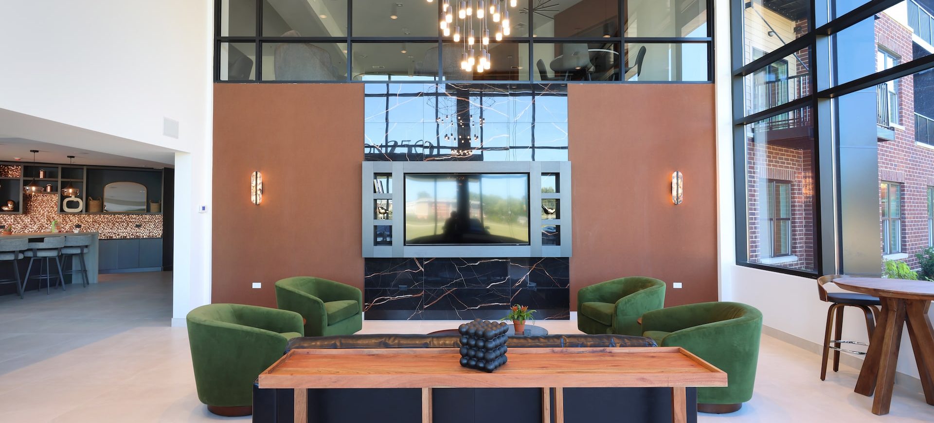 Station 250 co-working lounge with modern furniture, pendant lighting, and collaborative workspace design Mundelein IL