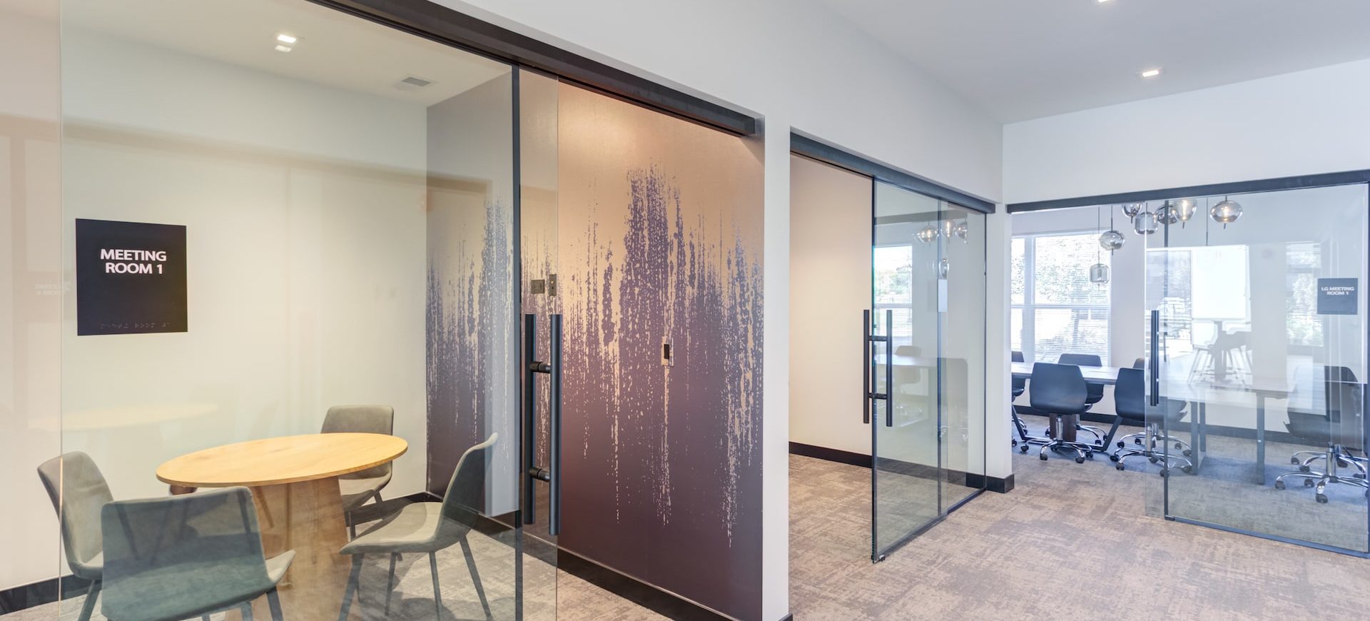 Station 250 collaborative workspace with modern table, chairs, and professional meeting environment Mundelein IL