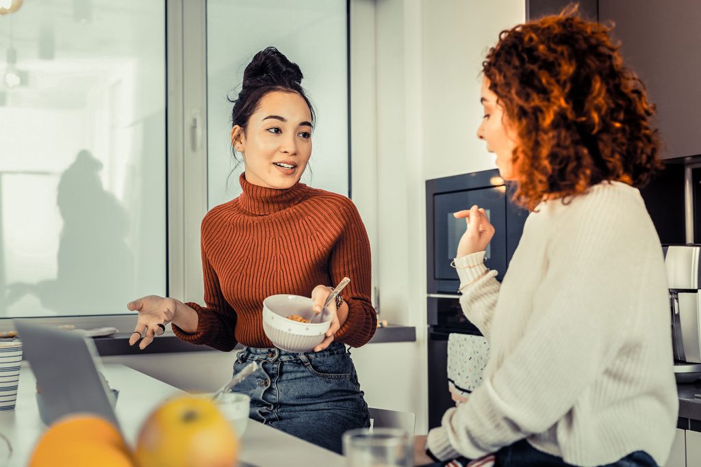Two Roommates talking in kitchen