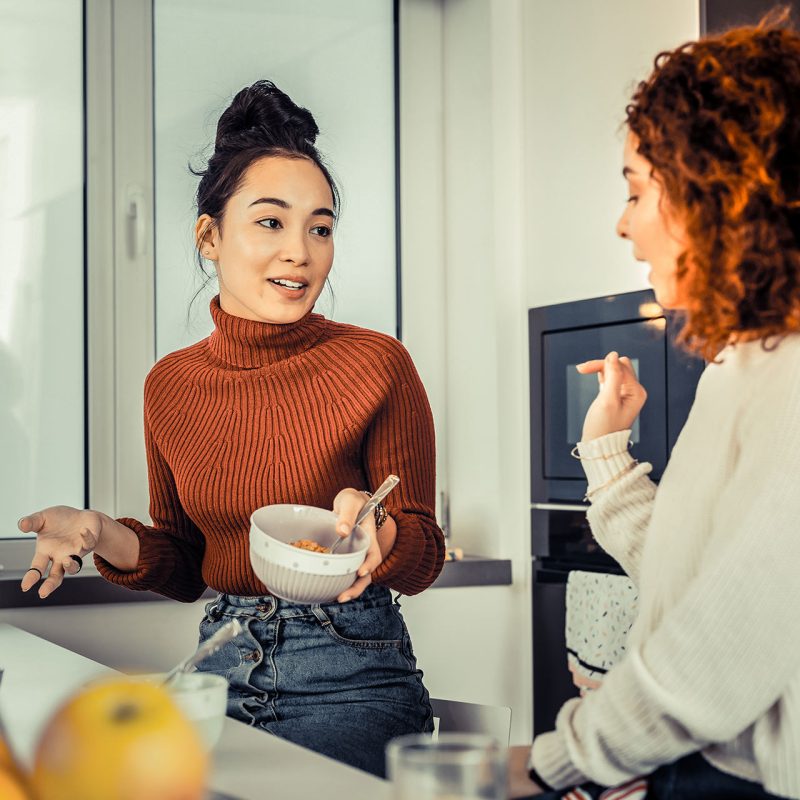 Two Roommates talking in kitchen